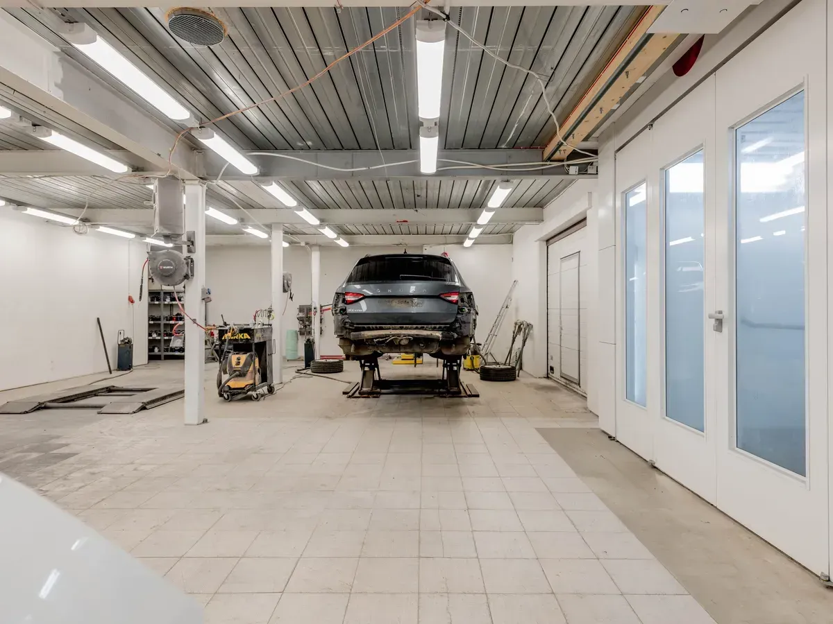 Cars being worked on inside the shop